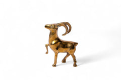 Brass ram sculpture on a white background