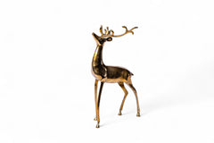 Gold deer figurine on a white background