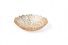 Gold decorative bowl with a coral-like pattern on a white background