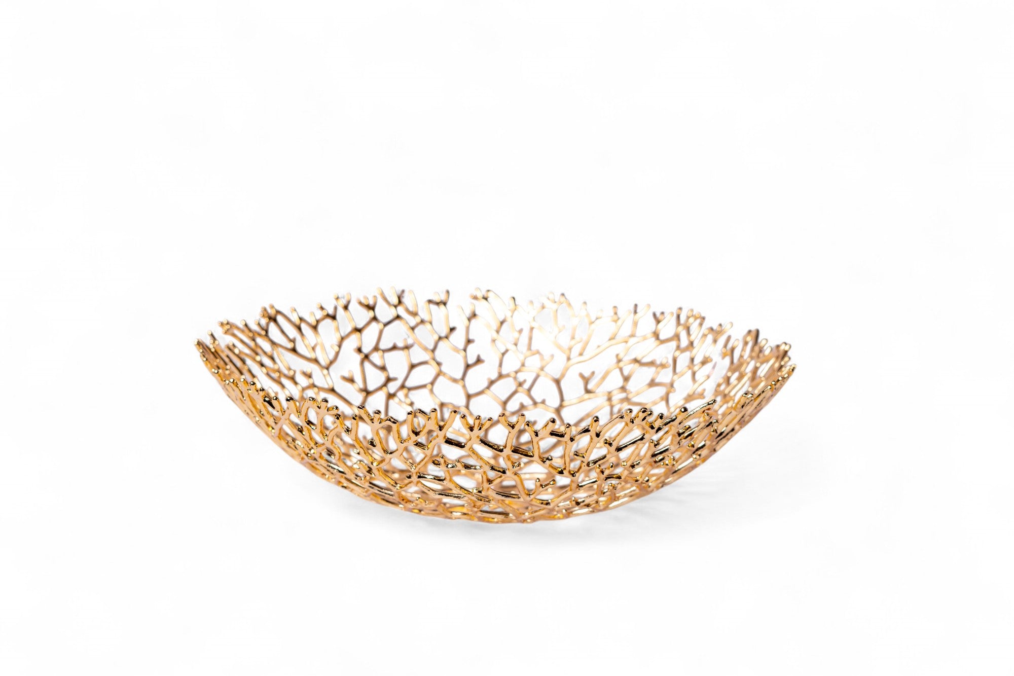 Gold decorative bowl with a coral-like pattern on a white background