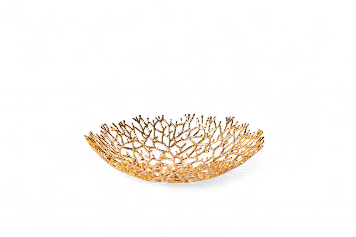 Gold decorative bowl with a coral-like design on a white background
