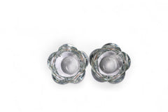 Pair of clear glass candle holders on a white background