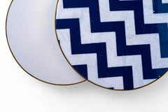 Navy blue and white zigzag patterned coasters on a white background