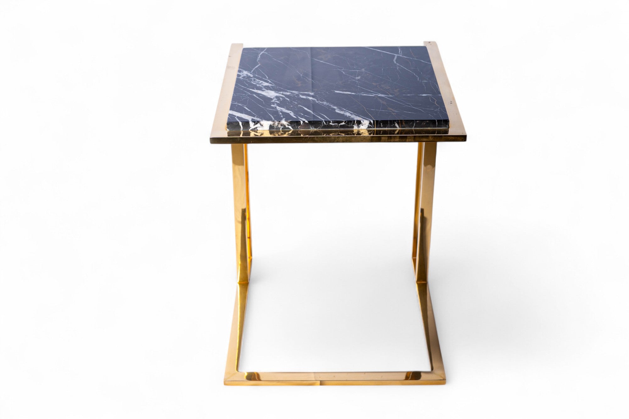 Small table with marble top and gold frame on a white background