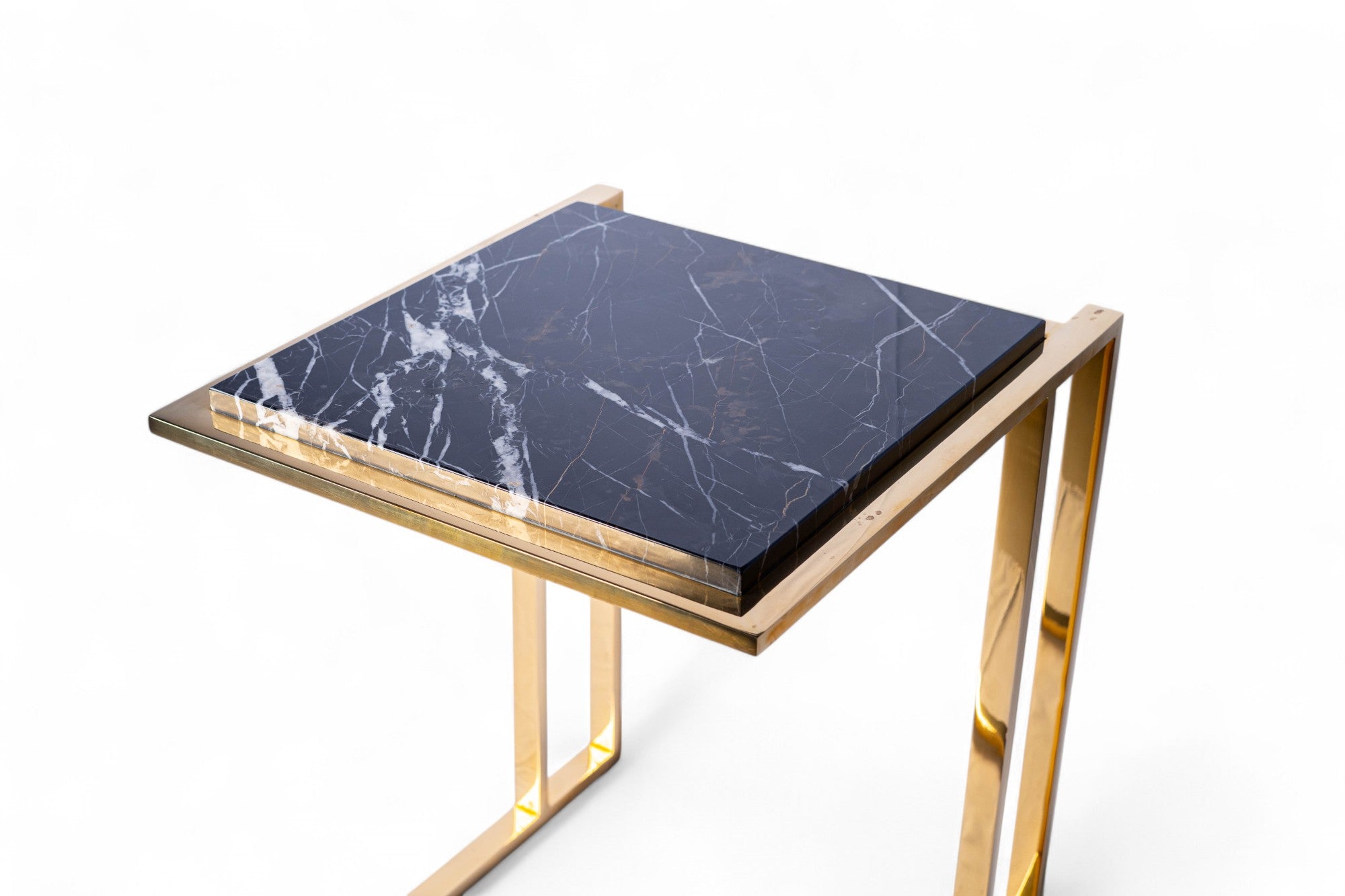 Small table with marble top and gold frame on a white background