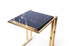 Small table with marble top and gold frame on a white background