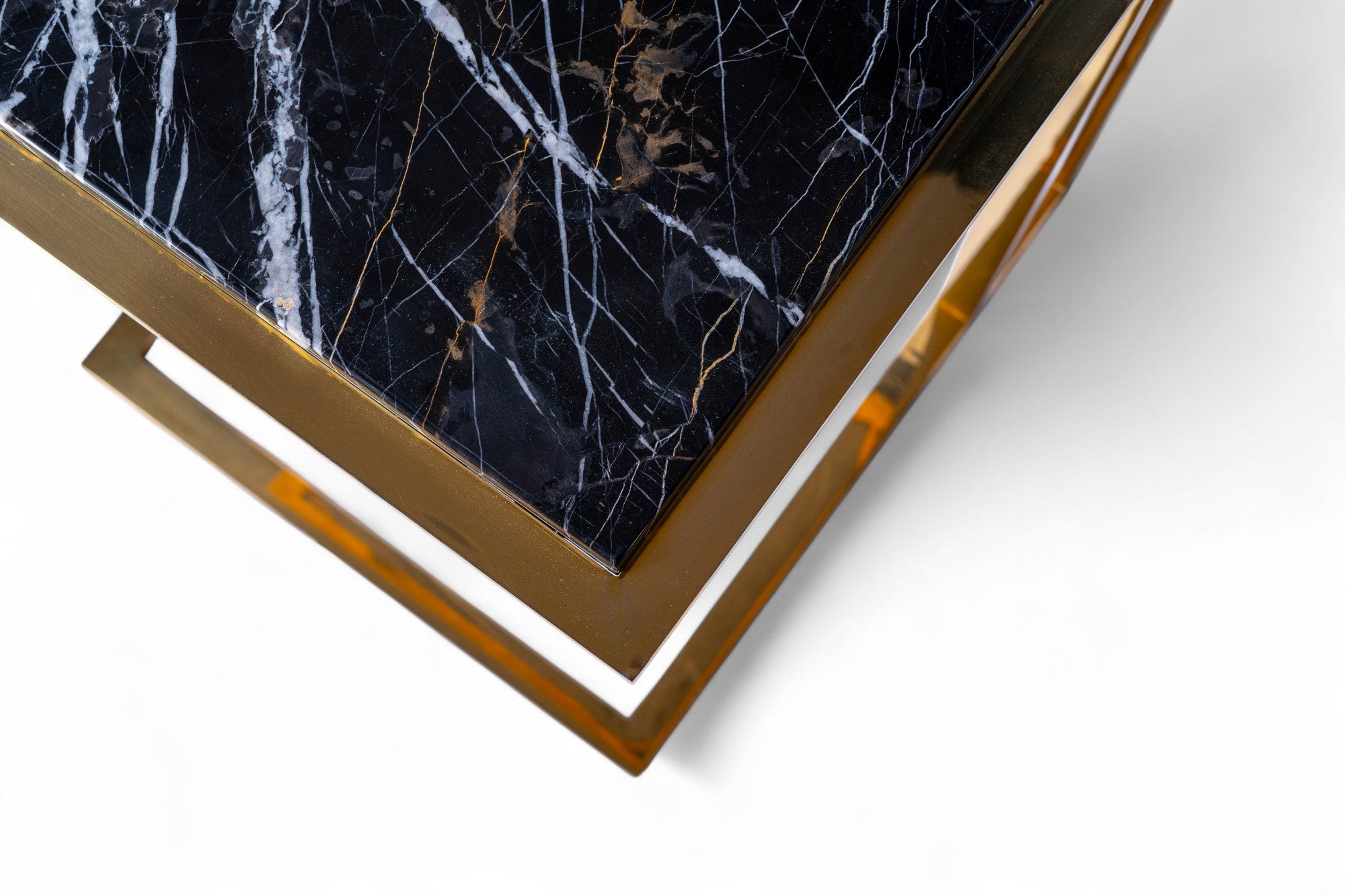 Decorative box with marble pattern and gold accents on a white background