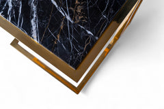 Decorative box with marble pattern and gold accents on a white background