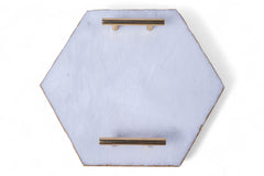 Hexagonal wall art piece with gold accents on a white background