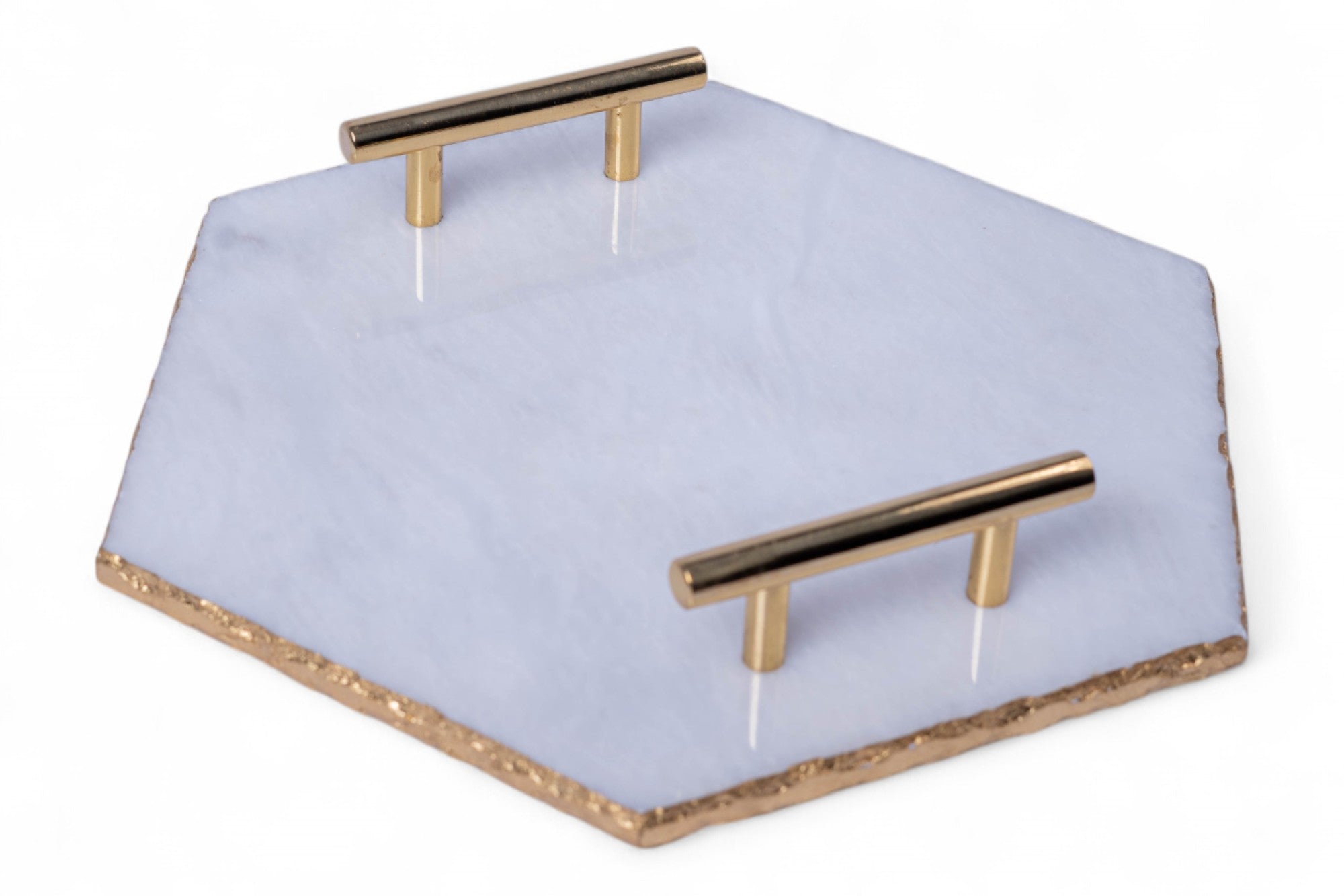 Hexagonal tray with gold handles on a white background