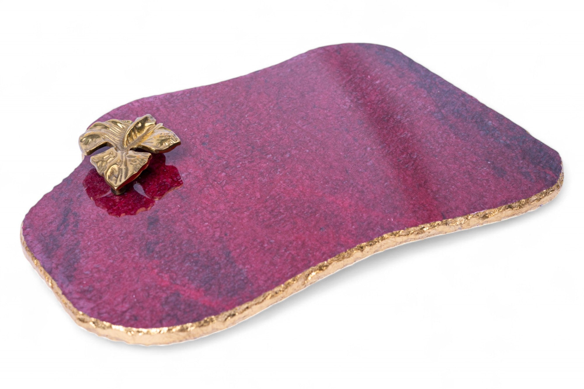 Purple stone with a gold butterfly on a white background