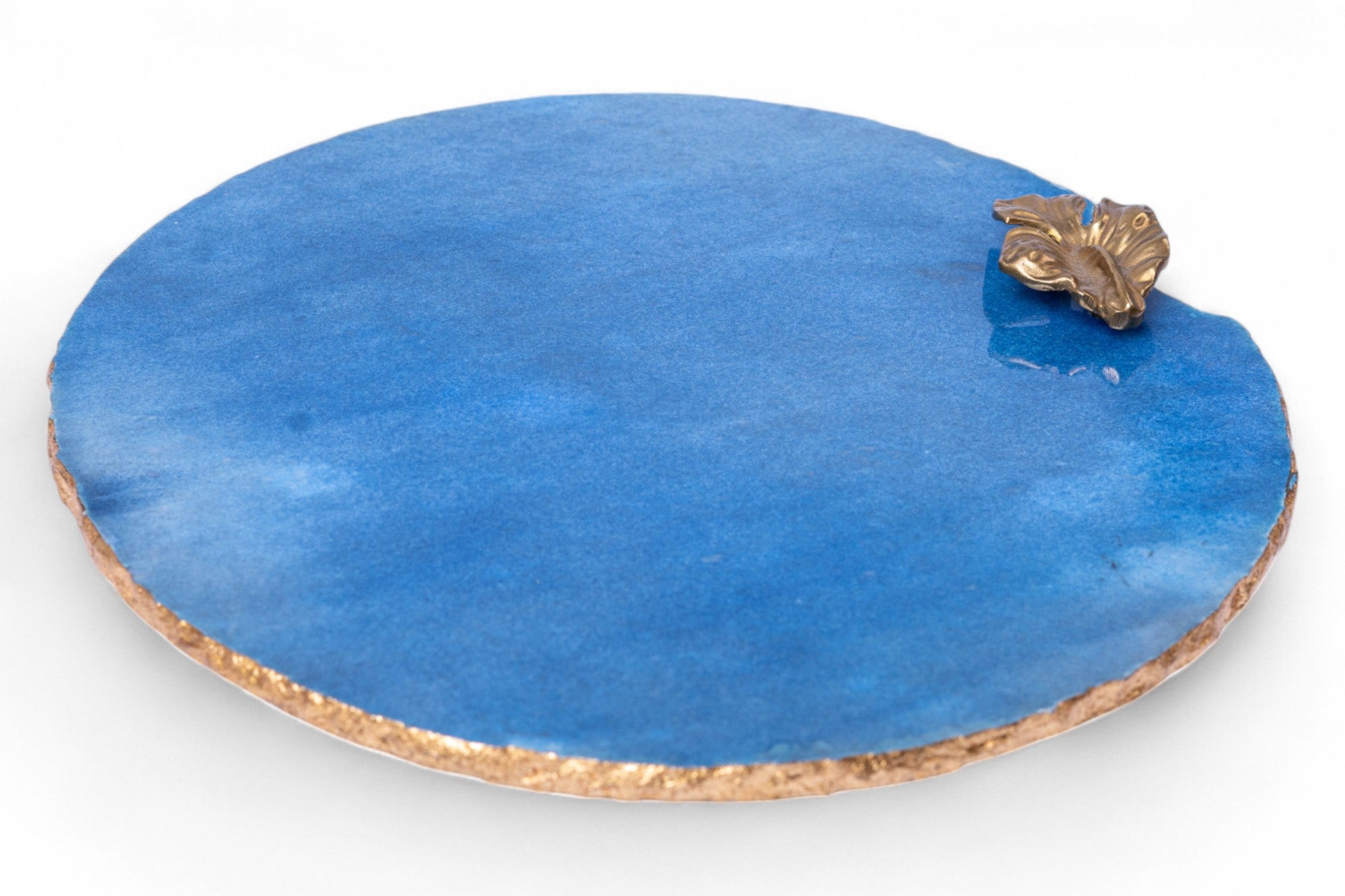 Blue round stone with a decorative gold accent on a white background