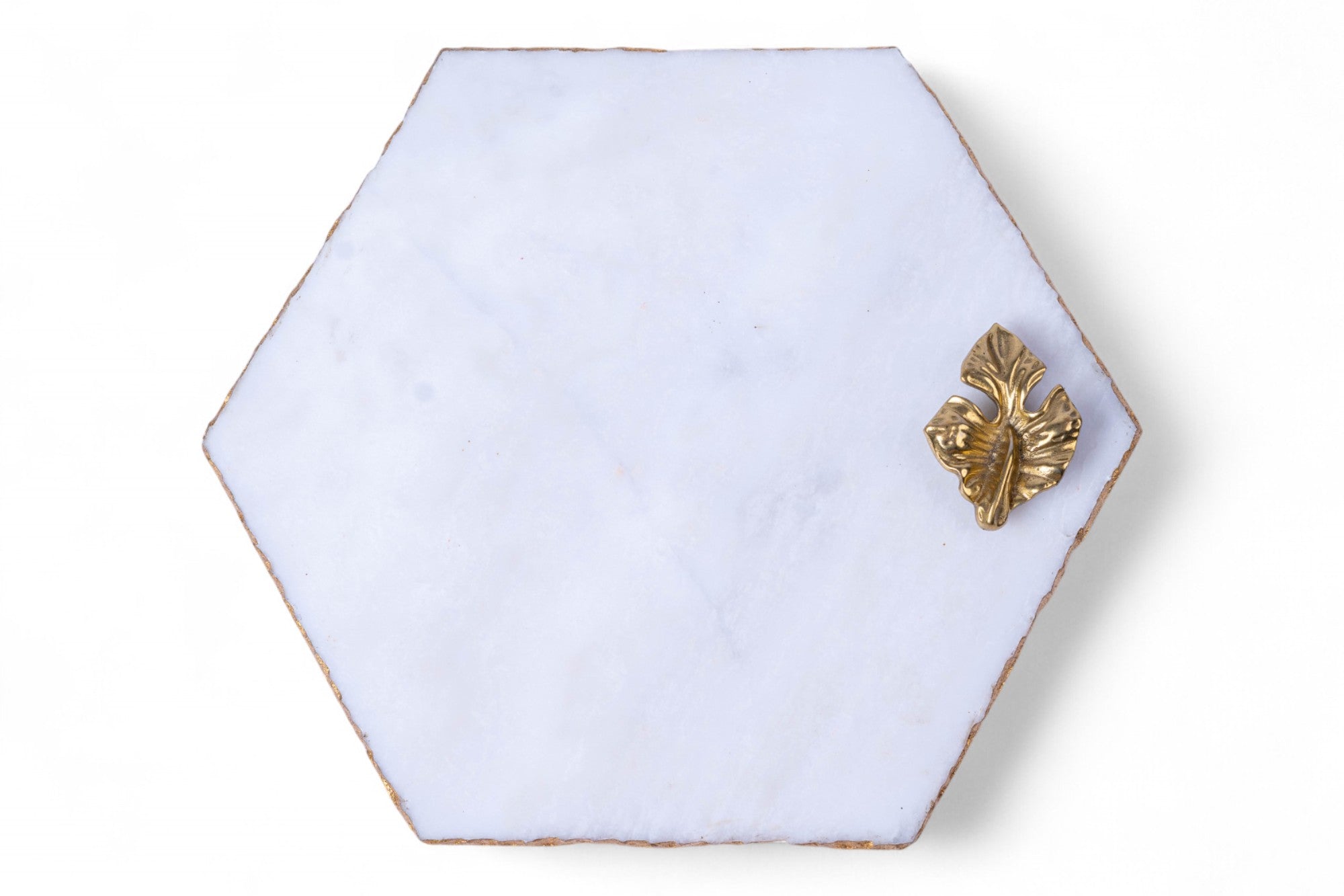 Hexagonal white tile with a gold fish design on a white background