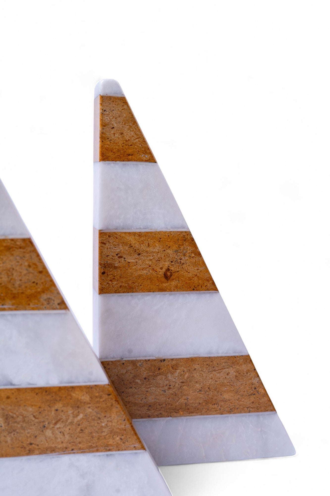 Two triangular wooden signs with white and brown stripes on a white background