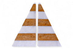 Two triangular coasters with cork and white stripes on a white background