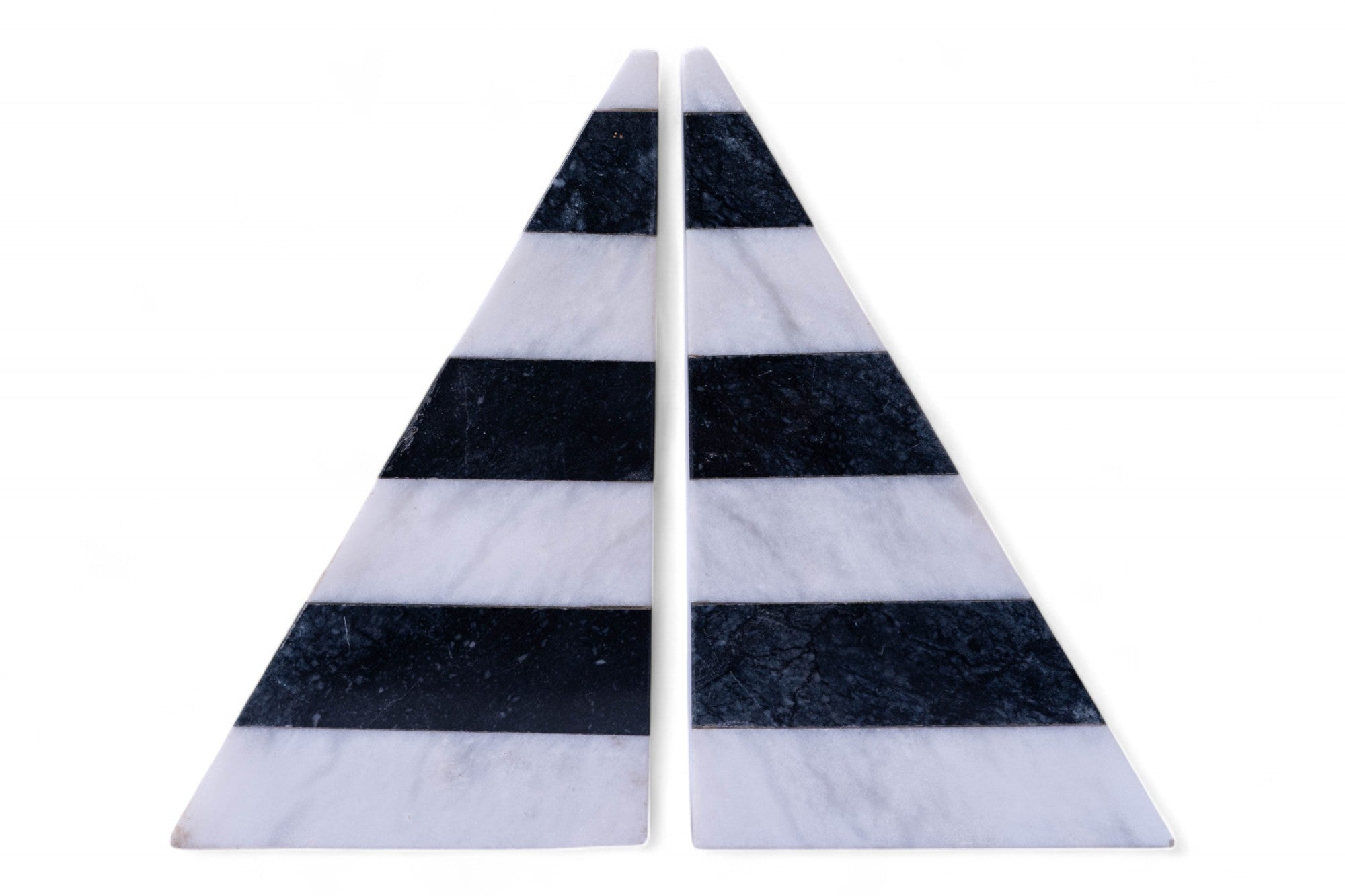Two triangular marble coasters with black and white stripes on a white background