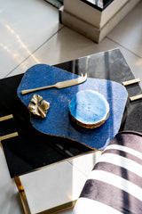 Decorative table with blue stone surface and gold accents