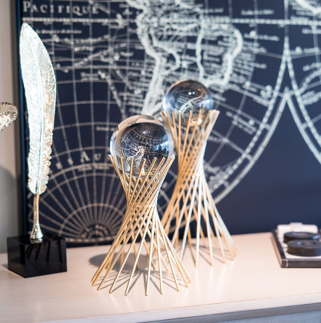 Decorative items on a shelf with a world map in the background