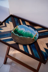 Decorative tray with wave design on a wooden table